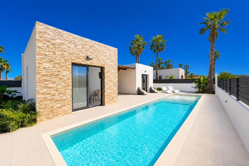 a swimming pool in the backyard of a villa at Villa Salty Sun 6 in Kremasti
