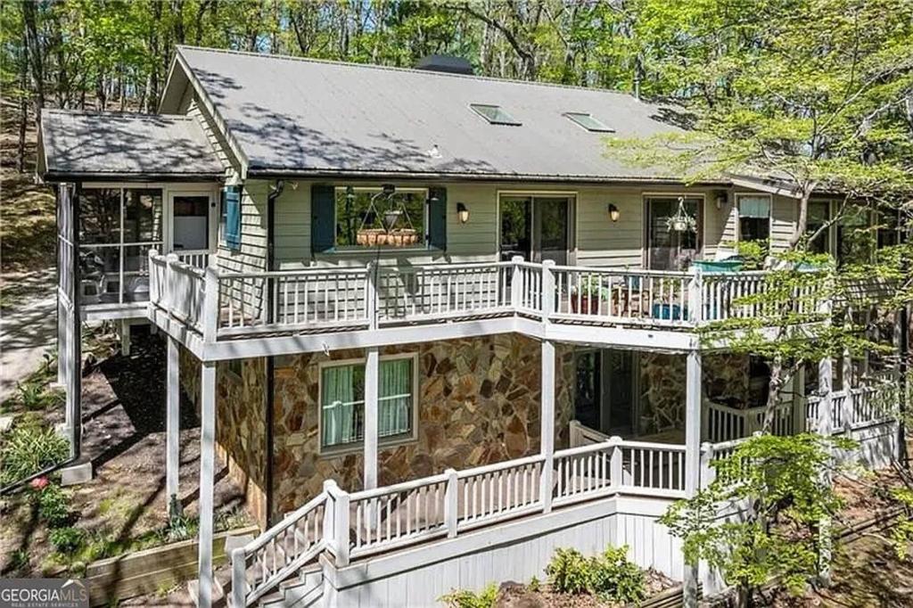 a large house with a wrap around porch at Vista Ridge at Alpine 4BDR in Jasper