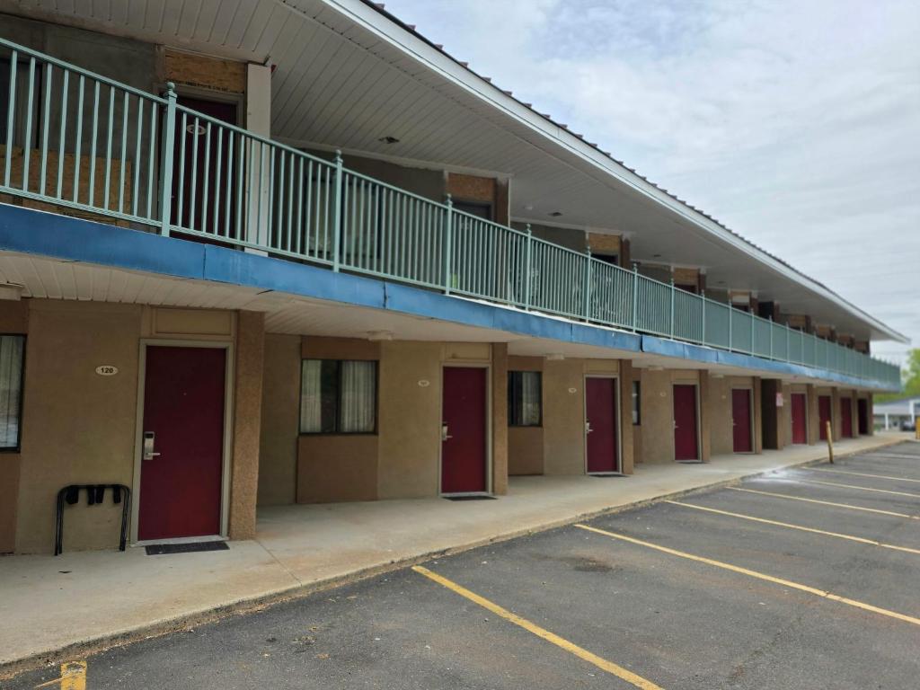 an empty parking lot in front of a building at Red Roof Inn Green Brook - Somerset in Green Brook