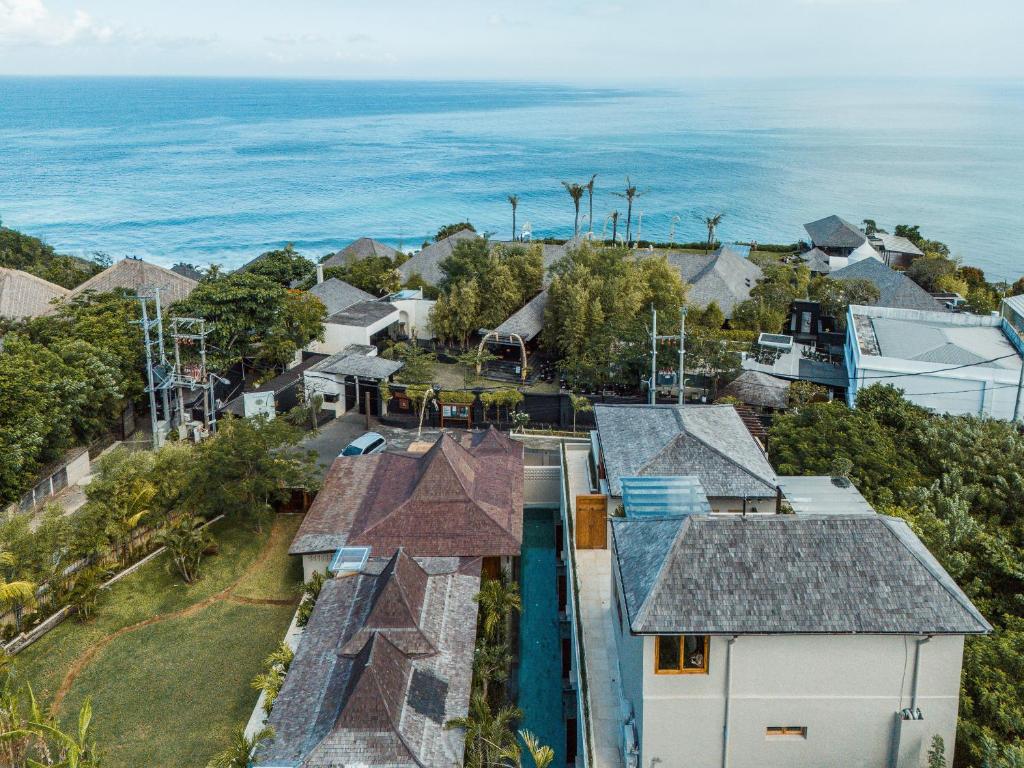 an aerial view of a house with the ocean in the background at Salty Lotus in Uluwatu