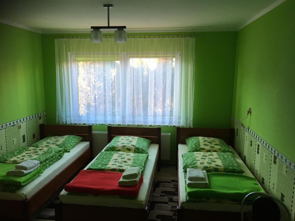 Postel nebo postele na pokoji v ubytování Pod Kasztanem