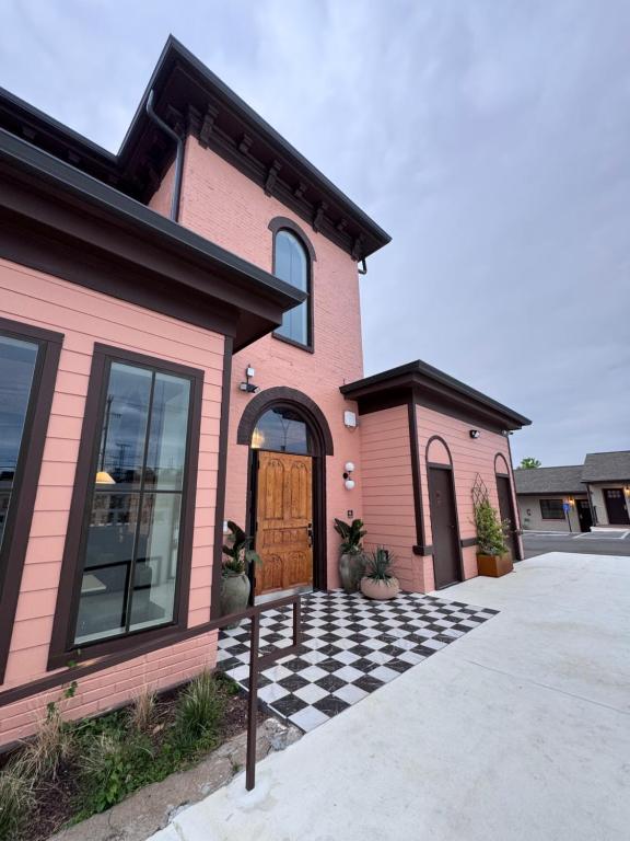 a pink house with a checkered driveway at Salt Ranch Hotel in Nashville
