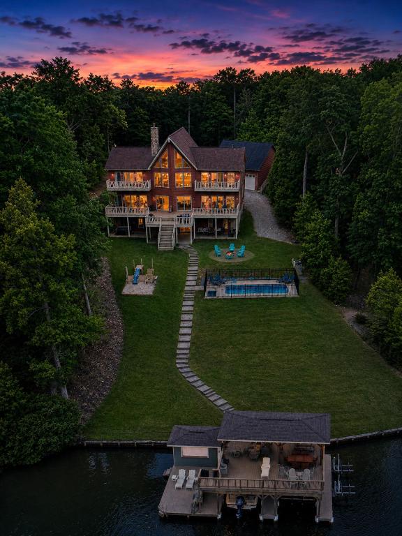 an aerial view of a large house on the water at Ultimate LKA Retreat Boatdock Heated Pool Hottub in Mineral
