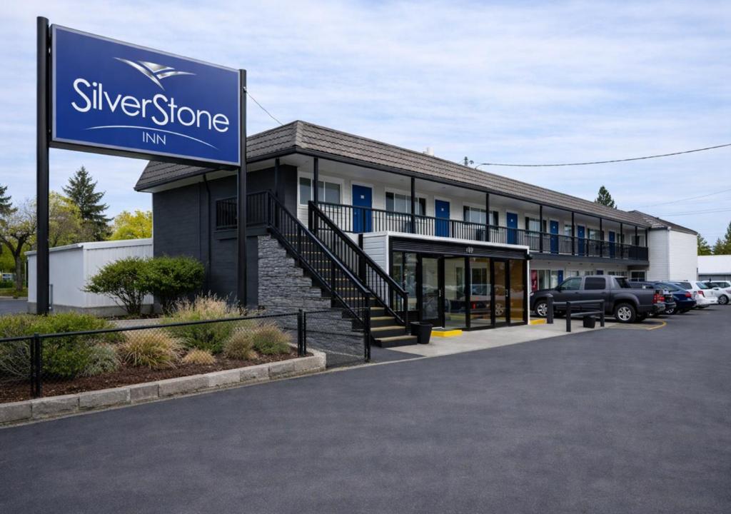 a silver stone inn sign in front of a parking lot at SilverStone Inn North Spokane in Spokane