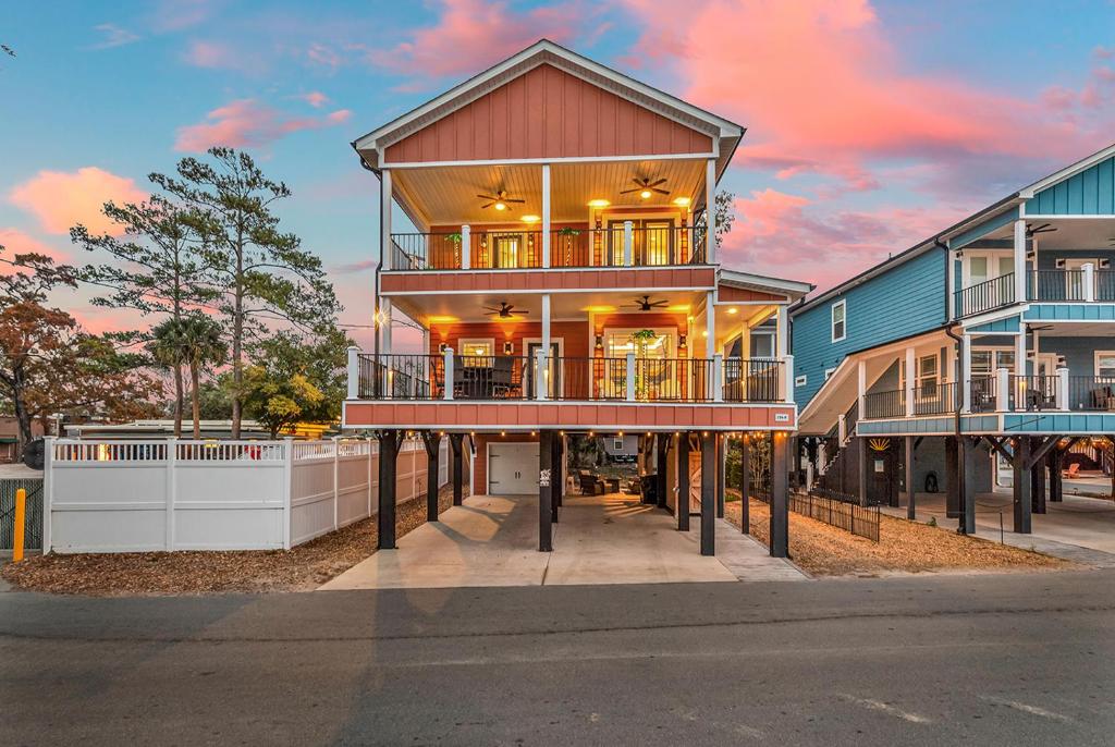 a house on the side of a street at Ocean Lakes Walk to beach! Waterpark! Arcade! Dogs Welcome! in Myrtle Beach