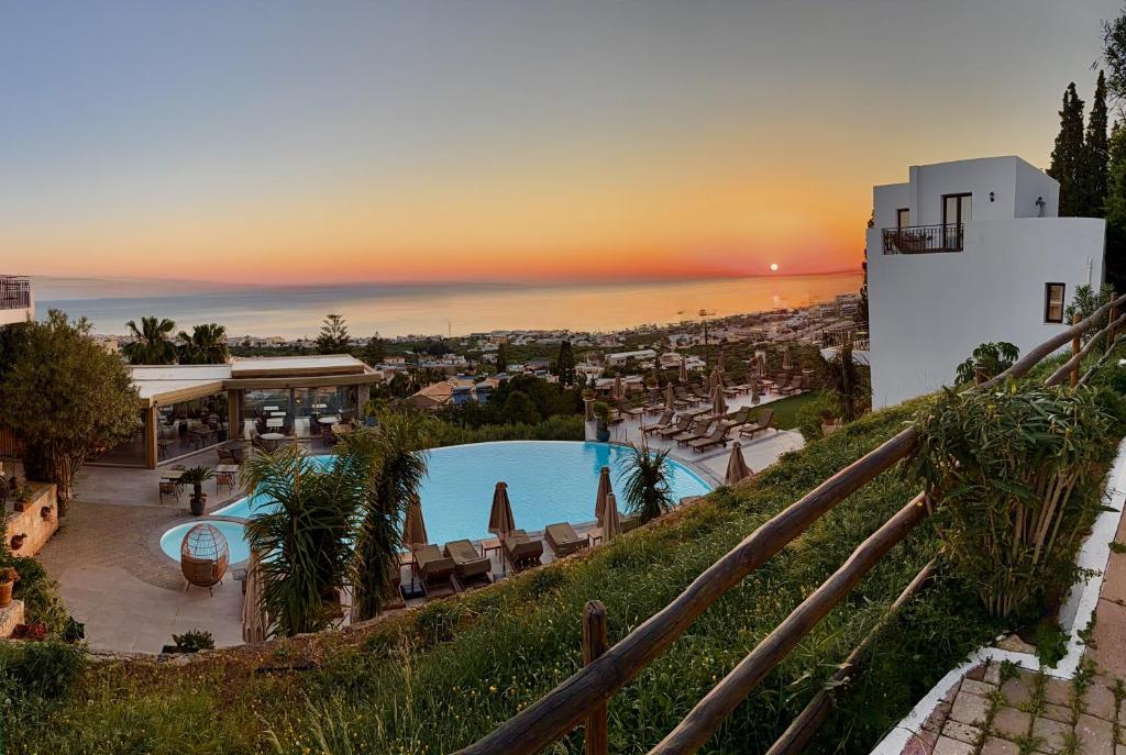 a view of a resort with a swimming pool at Creta Blue Boutique Hotel in Hersonissos