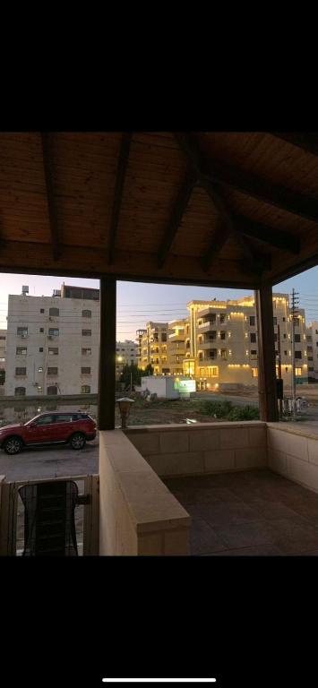 a view of a parking lot with a car in a city at عمان - ضاحية النخيل in Amman