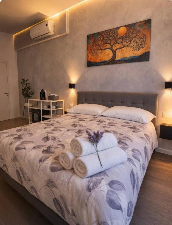 a bedroom with a bed with towels on it at Sogni Di Luna in Scandicci