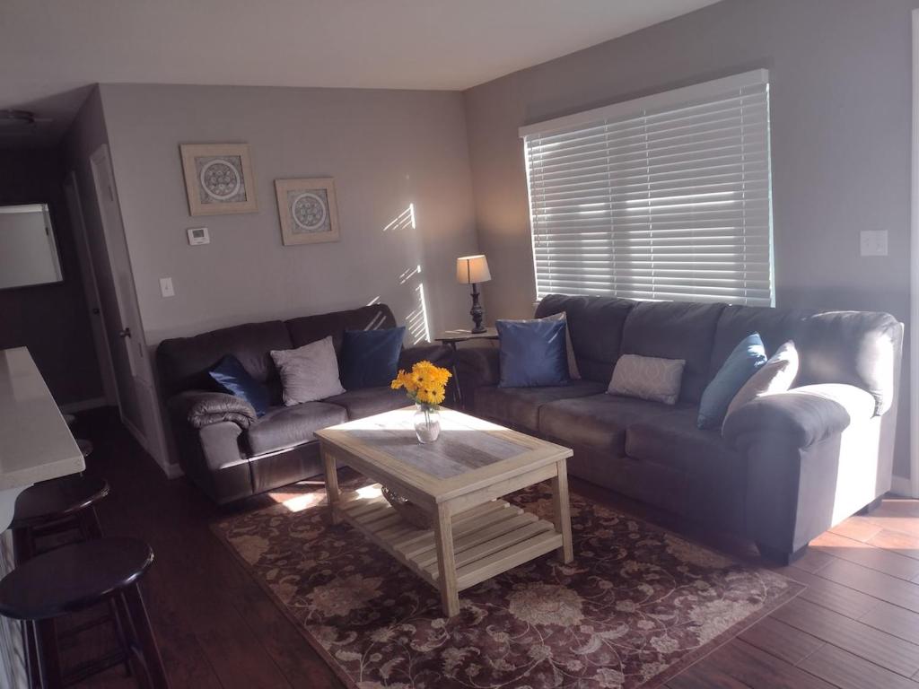 a living room with a couch and a table at Whole House All Yours! in Cocoa