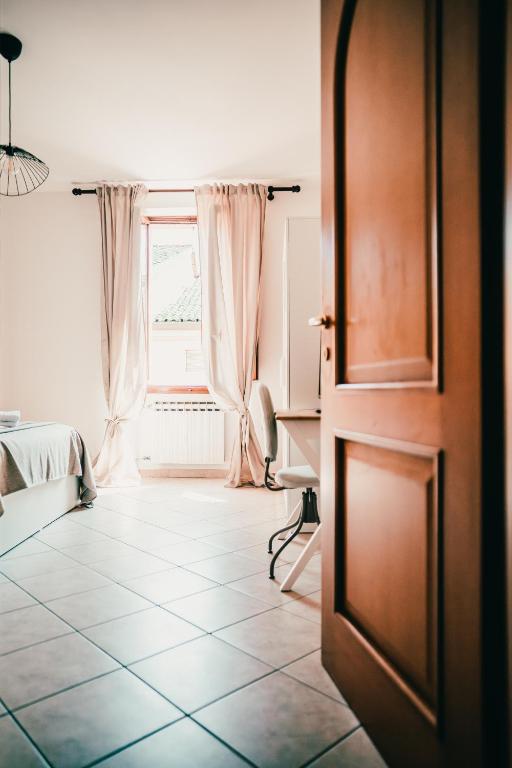 an open door in a room with a window at Bixio 7 Boutique stay in Imola