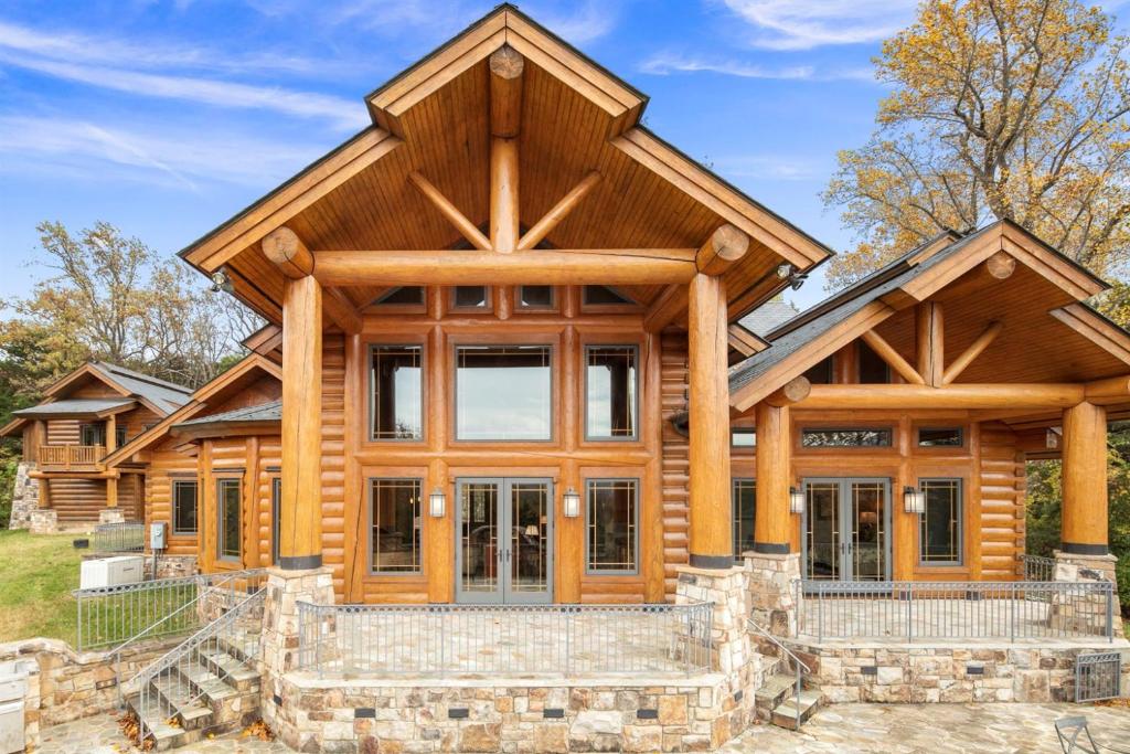 a log home with a gambrel roof at Hamatreya- Panoramic Shenandoah Views in Rileyville