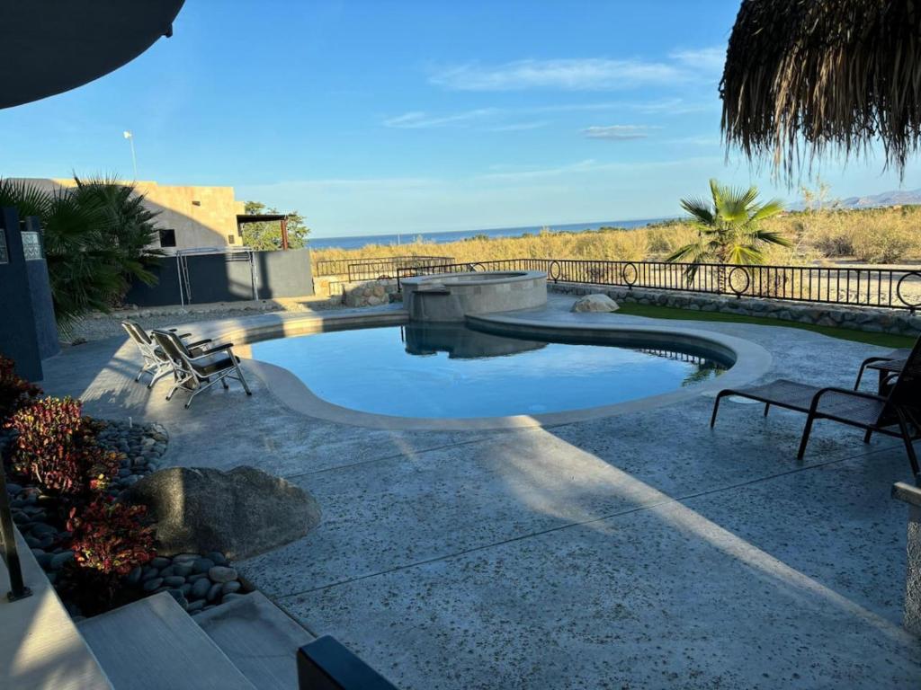 a swimming pool in the middle of a patio at Sunny Poolside Escape Near the Beach in Los Barriles