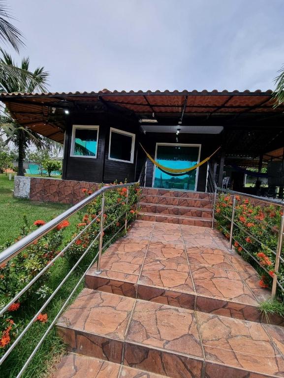 a set of stairs leading to a house at Cabana do Parque in Presidente Figueiredo