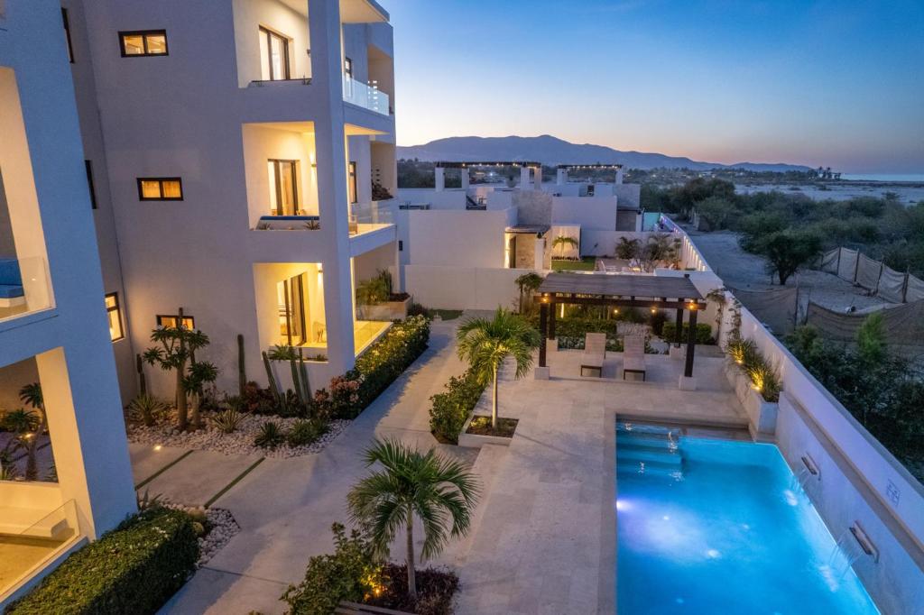an aerial view of a building with a swimming pool at Seize the Day at Carpe Diem Condo in Los Barriles