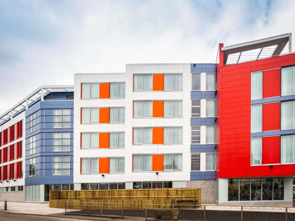 an apartment building with red white and blue at Mercure Bridgwater in Bridgwater