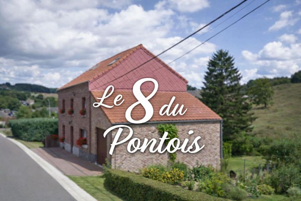 a building with a sign that reads be and all portfolios at Le 8 du Pontois in Ciney