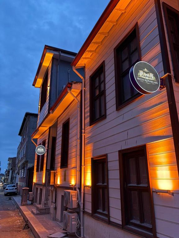 a building with a sign on the side of it at Avlia Konakları in Edirne