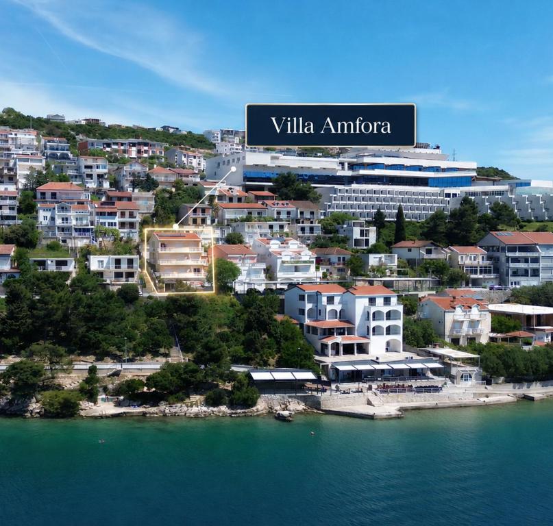 a view of a city next to a body of water at Apartmani Villa Amfora - Free Parking in Neum