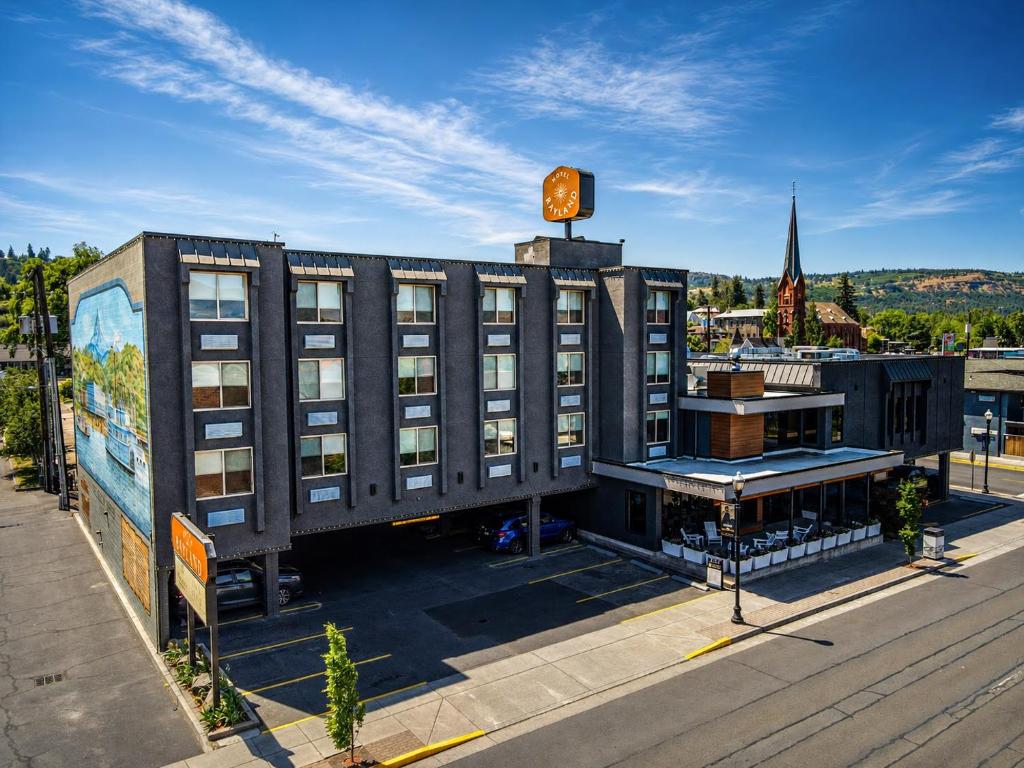 a building with a clock on top of it at Rayland Hotel in The Dalles