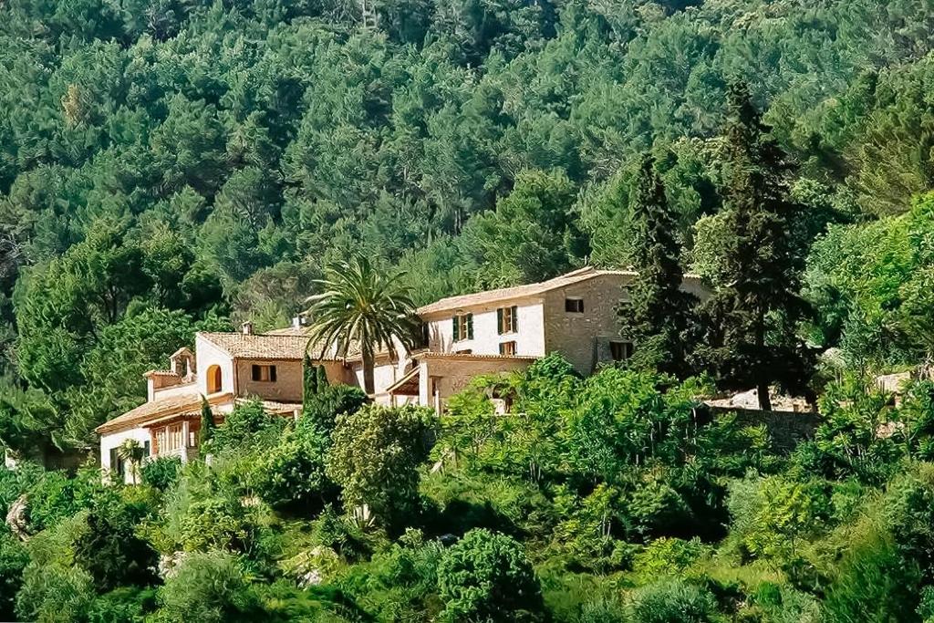 a house on the side of a mountain at Posada del Marqués I A Slow Design Hotel in Esporles