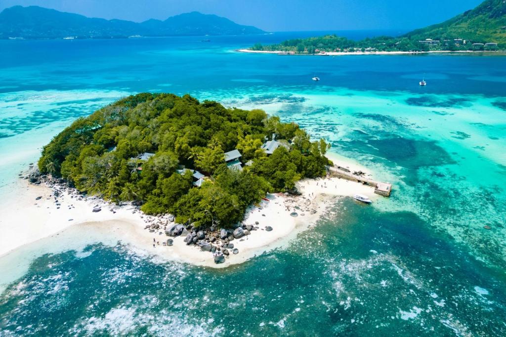 an island in the middle of the ocean at Enchanted Island Resort in Mahe
