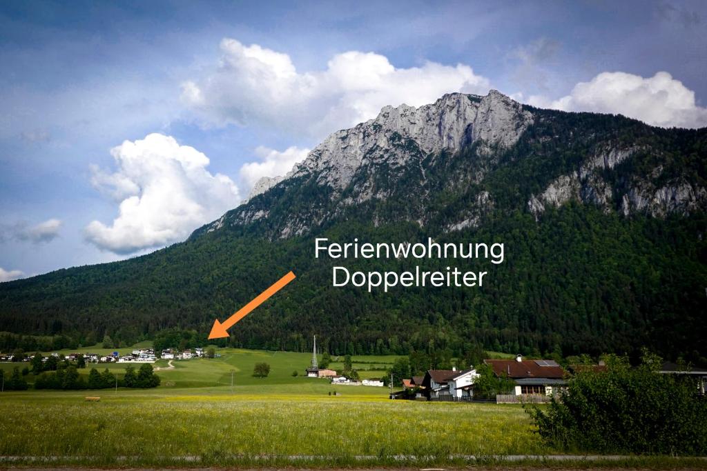 a mountain with the words feathering doppelminingdorff at Ferienwohnung Doppelreiter in Ebbs