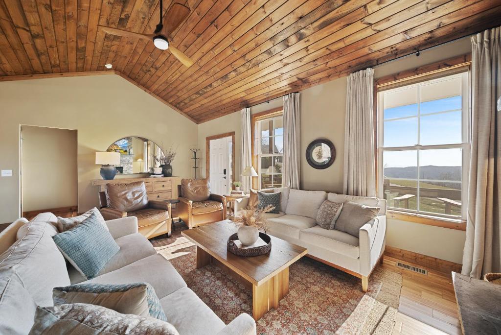 a living room with a couch and a table at Alpine Retreat in Seven Devils