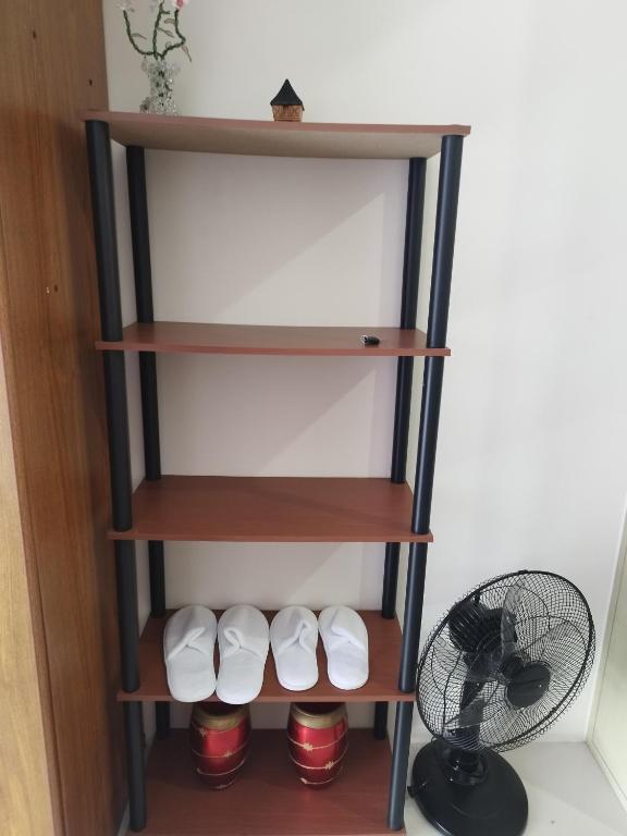 a shelf in a room with a fan at Wind Residences in Tagaytay