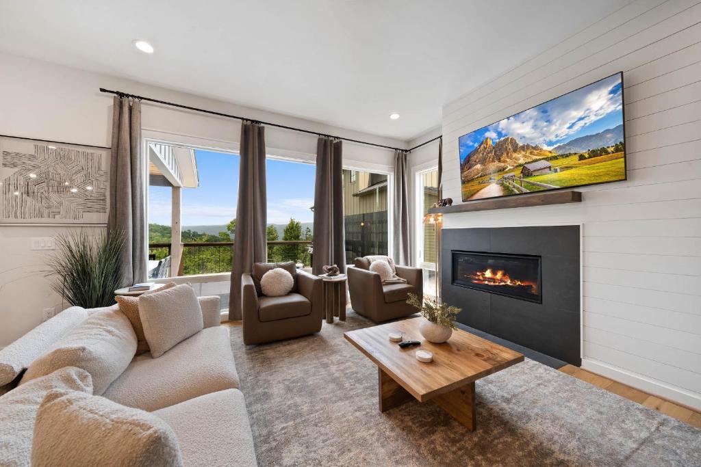 a living room with a couch and a fireplace at Luxury Trails Escape in Boone