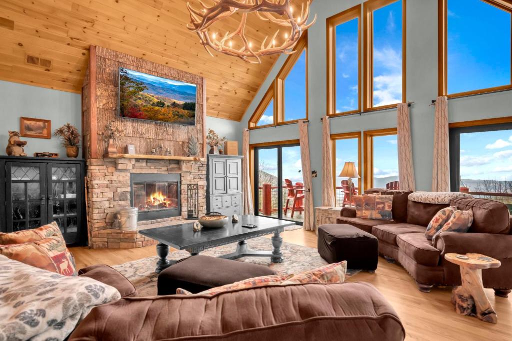 a living room with a couch and a fireplace at Ace of Diamonds in Seven Devils
