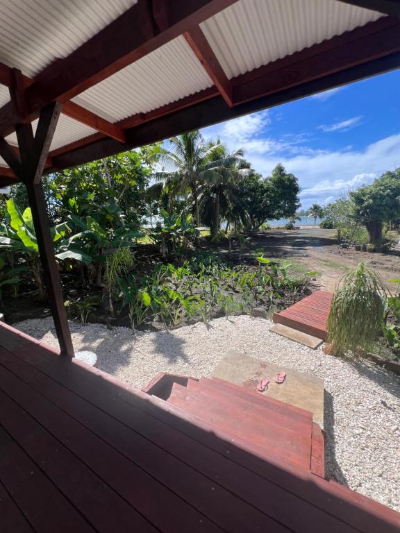 a view of a backyard from a wooden fence at Kai Kabana Chill in HUH