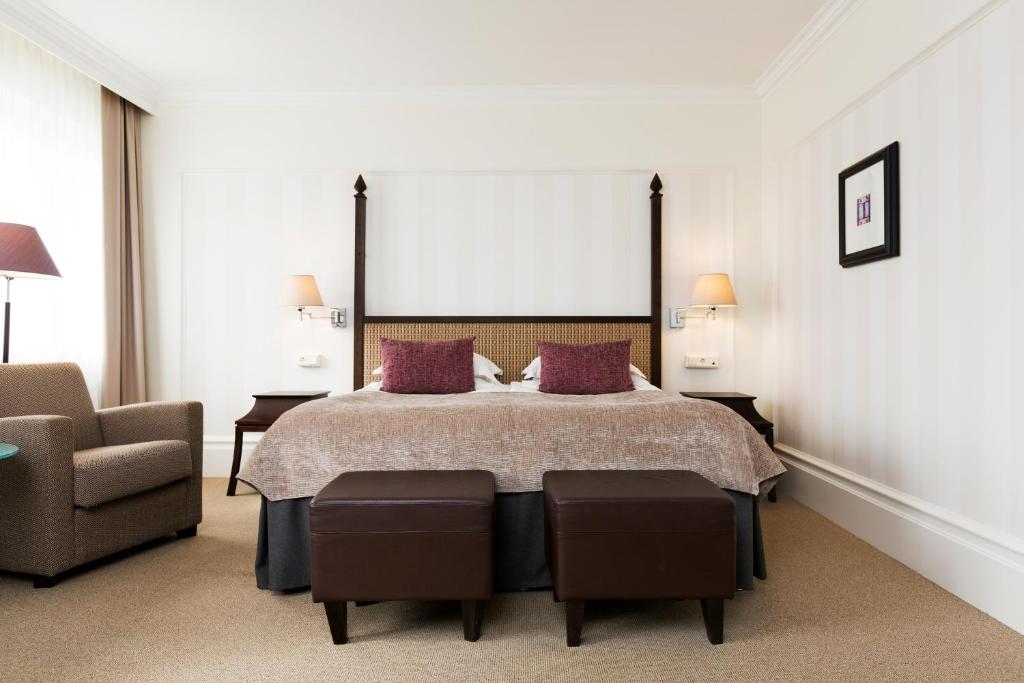 Ein Bett oder Betten in einem Zimmer der Unterkunft Elite Park Avenue Hotel