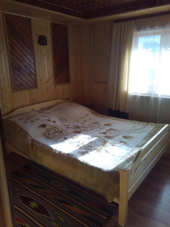 Postel nebo postele na pokoji v ubytování Homestay Opryshky