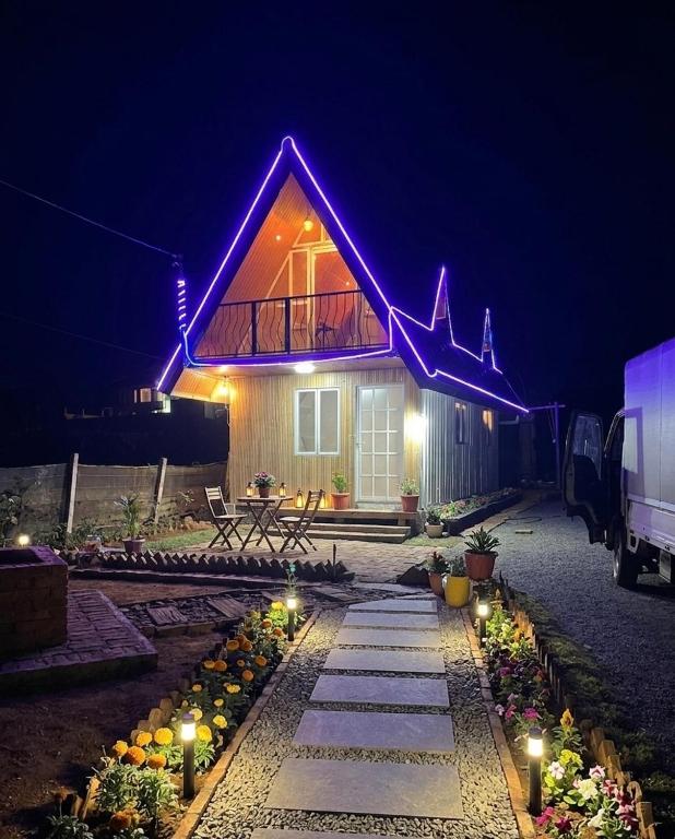 a house with purple lights on the front of it at CHILLY CHALET Cabana in Nuwara Eliya