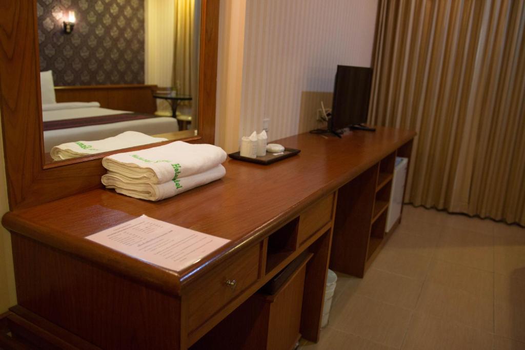 Postel nebo postele na pokoji v ubytování Natural Samui Hotel
