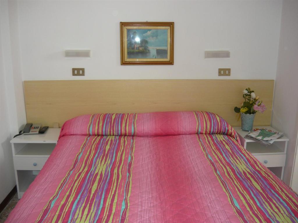 Postel nebo postele na pokoji v ubytování Hotel Acquazzurra
