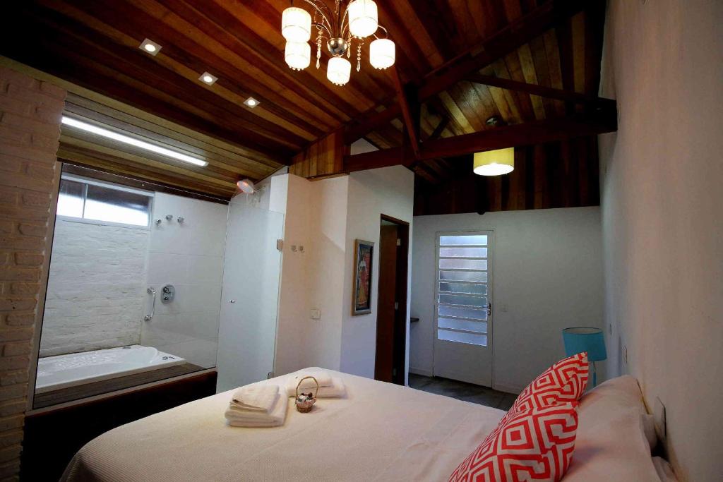 Katil atau katil-katil dalam bilik di Chácara Andó Bed And Breakfast