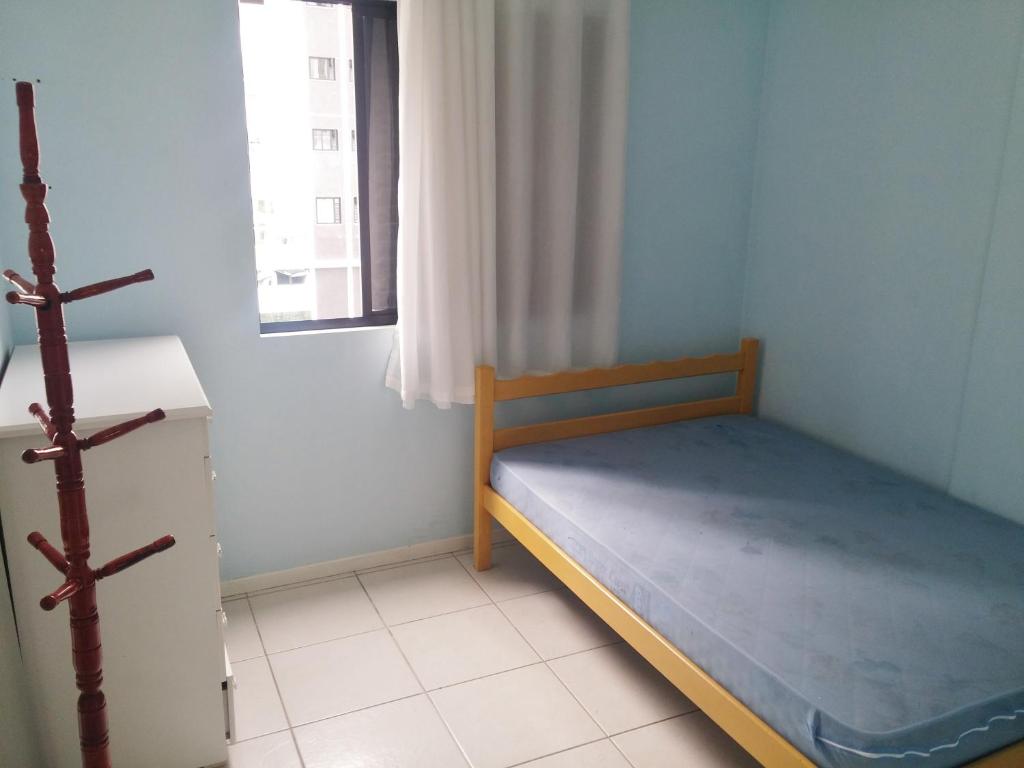 Cama o camas de una habitación en Apartamento Balneário Camboriú