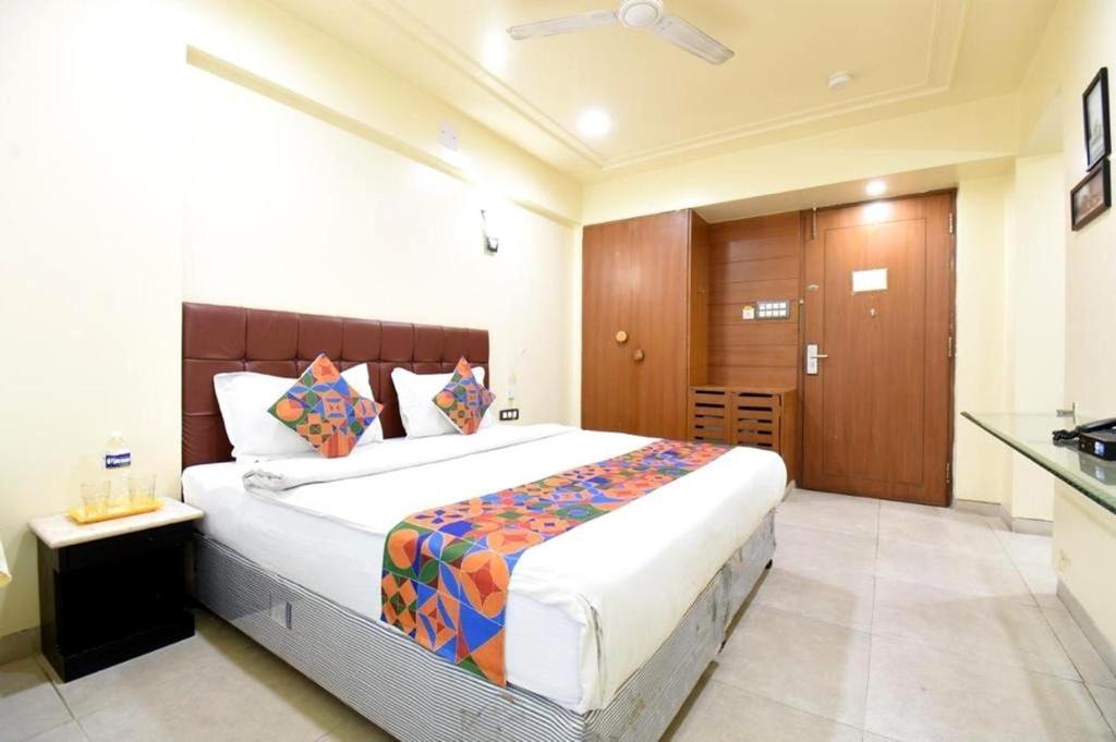 a bedroom with a large bed in a room at S R Rooms in Pune