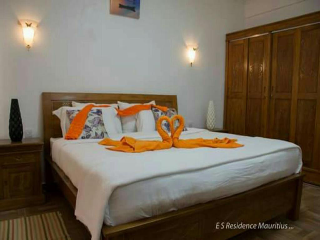 Postel nebo postele na pokoji v ubytování Easy Stay Residence