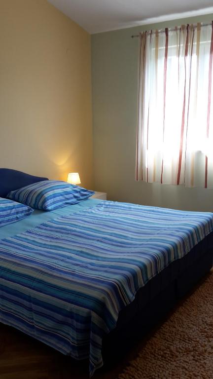 Säng eller sängar i ett rum på Apartment Ivo