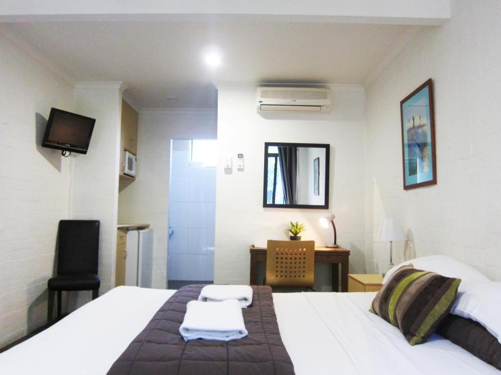 Postel nebo postele na pokoji v ubytování Horizons Motel