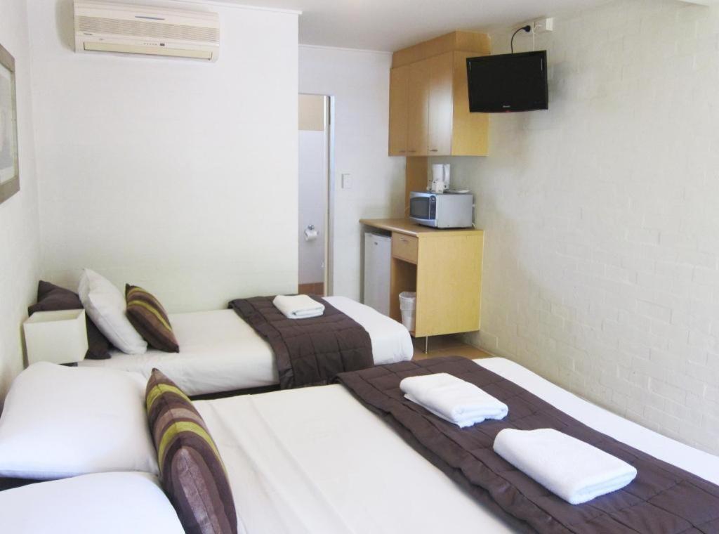 Postel nebo postele na pokoji v ubytování Horizons Motel