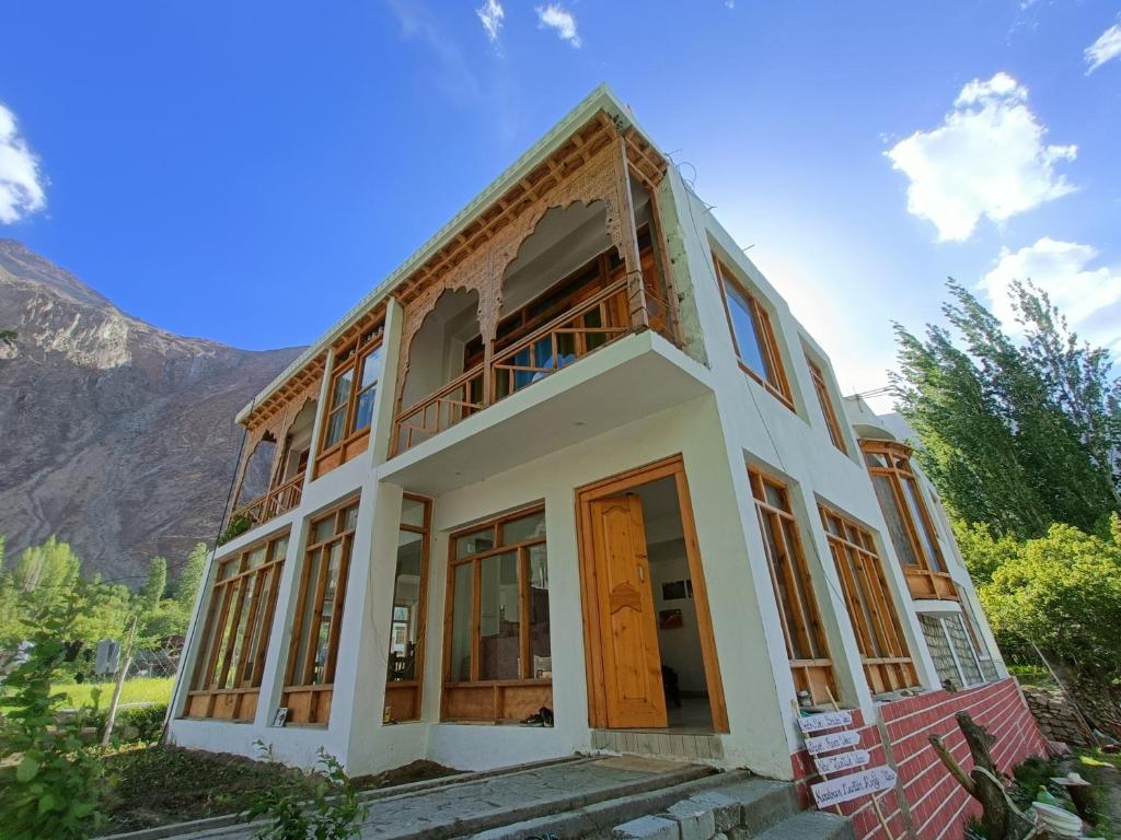 a house with a lot of windows at The Stone Palace Turtuk in Nubra