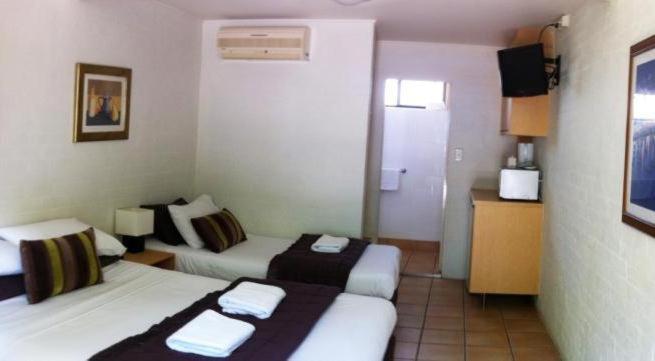 Postel nebo postele na pokoji v ubytování Horizons Motel