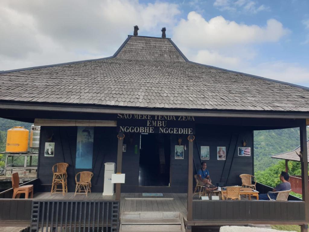 a building with a sign that reads sunflower inn van der waal volcanic museum at Zena Cottage in Ende