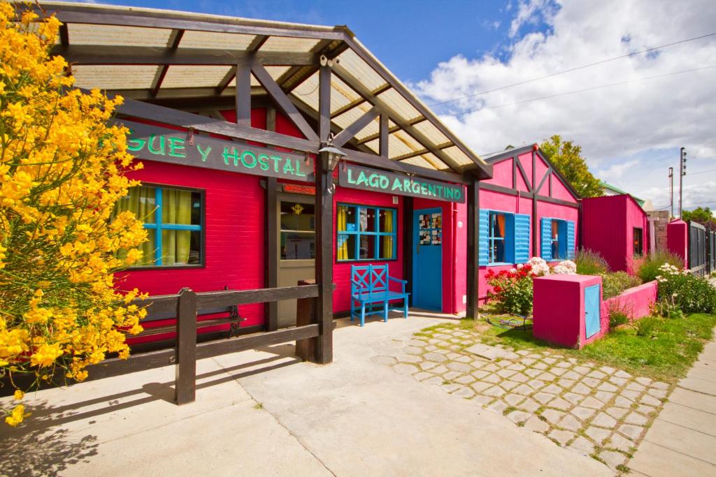 a colorful house with a bench in front of it at Lago Argentino B&B in El Calafate