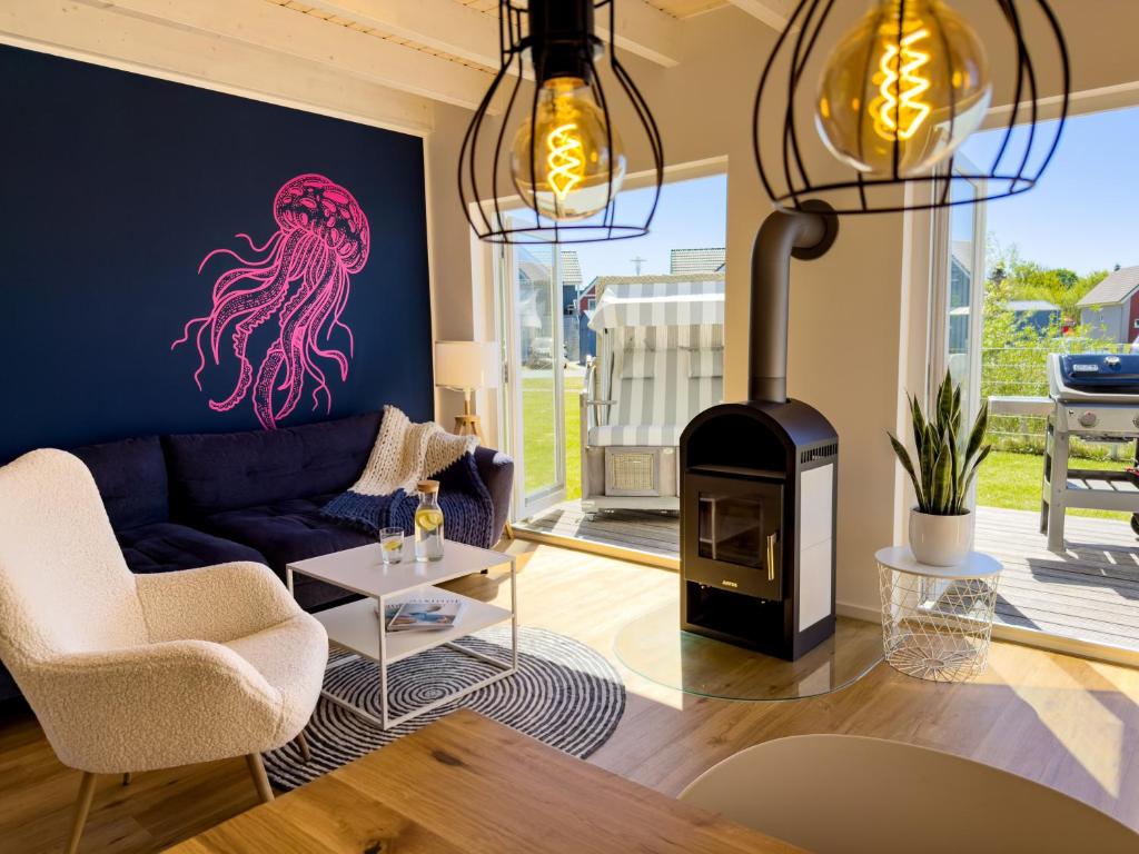 a living room with an octopus painted on the wall at Ferienhaus Fischkopf mit Sauna und Strandkorb in Büsum