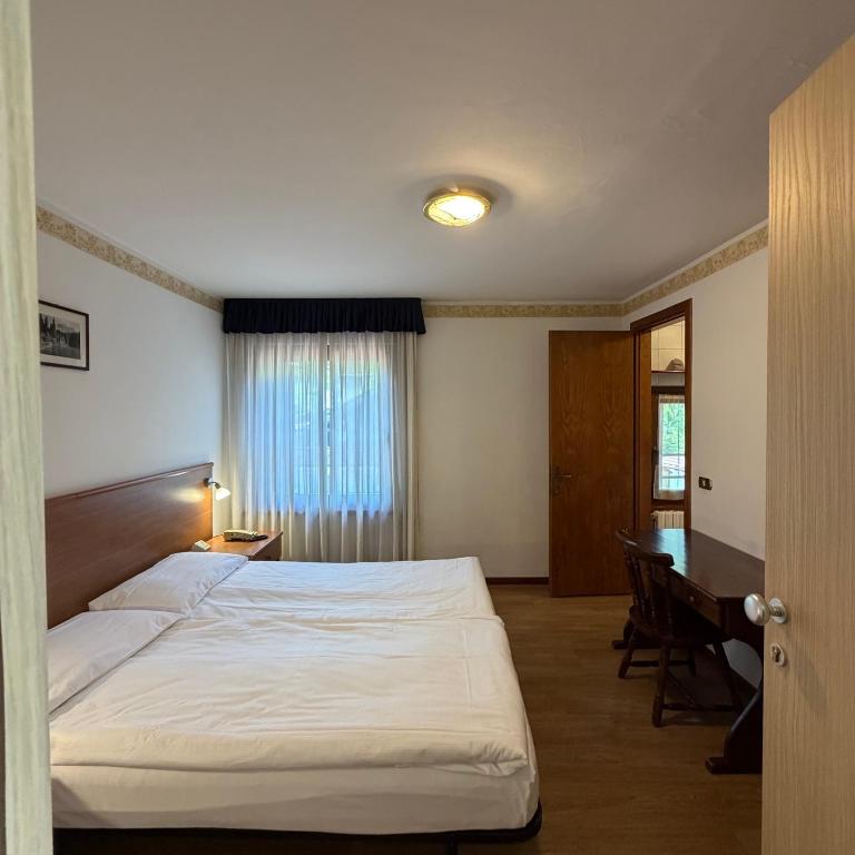 Llit o llits en una habitació de Single Rooms