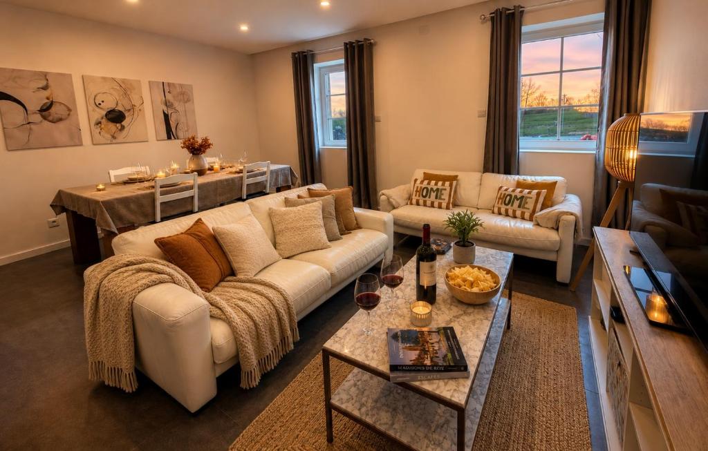 a living room with a couch and a table at Border Lodge in Évrange